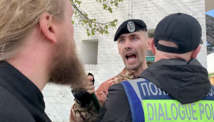 Activist Ruslan Hetman shouting at a Swiss citizen. Photo: UOJ