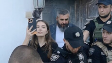 OCU cleric leads a female journalist to the altar of seized church