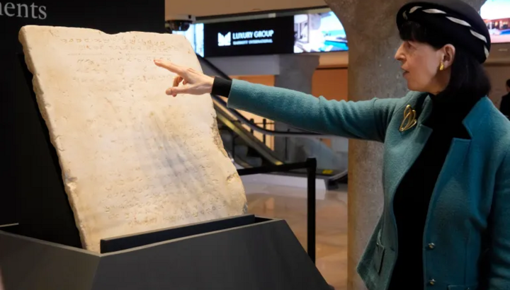 The tablet inscribed with the Ten Commandments is sold at an auction in New York. Photo: Richard Drew/AP